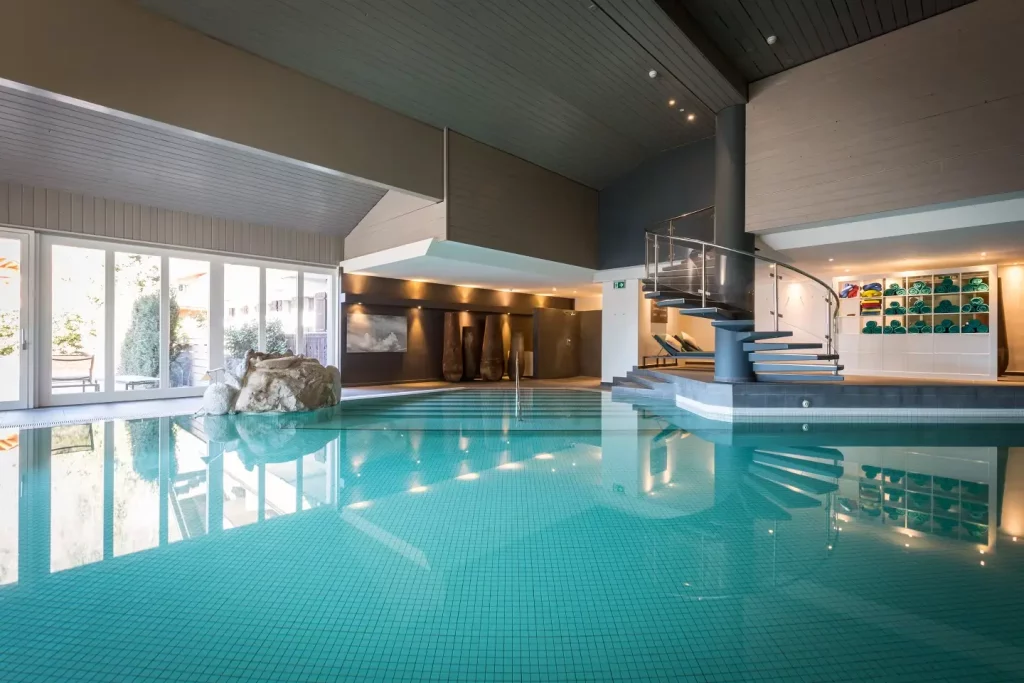 Heated indoor pool at HUUS Gstaad Hotel