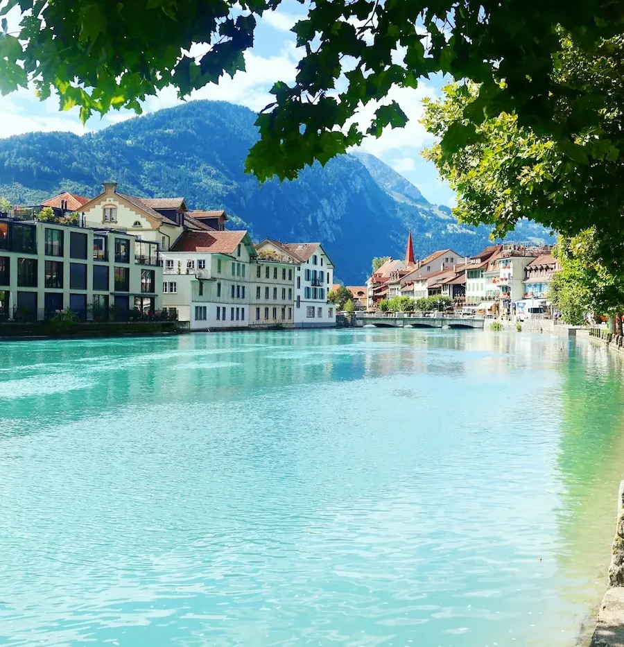Beautiful view of the Aare River and town architecture in Interlaken.