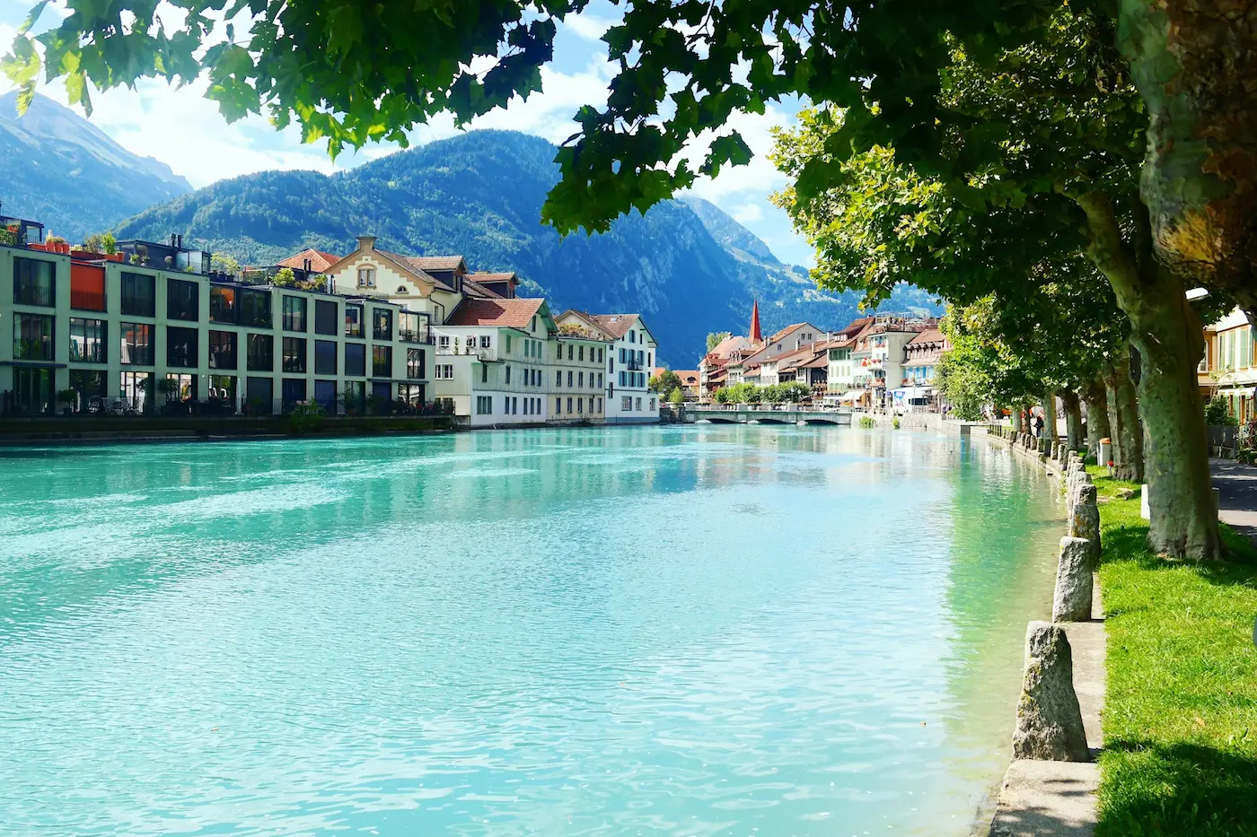 Beautiful view of the Aare River and town architecture in Interlaken.