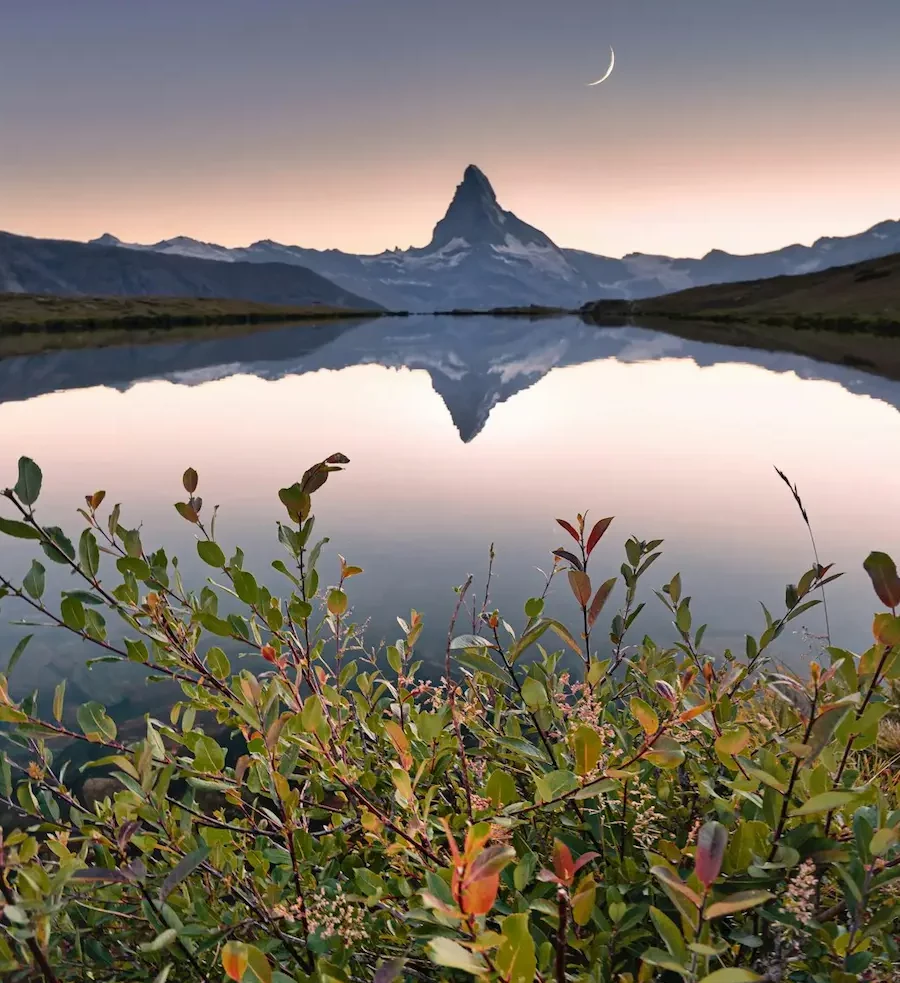 Scenic view of an alpine lake with the Matterhorn summit in the background in Zermatt